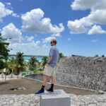 Bacalar Brokers' agent Dylan Mangold standing outside of El Fuerte de San Felipe in the town of Bacalar in Quintana Roo, México.