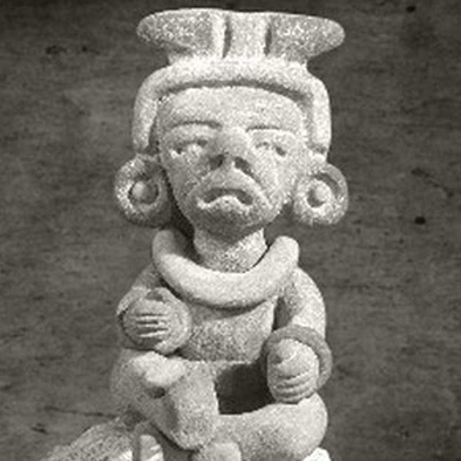 sculpture of ancient Maya alux creature